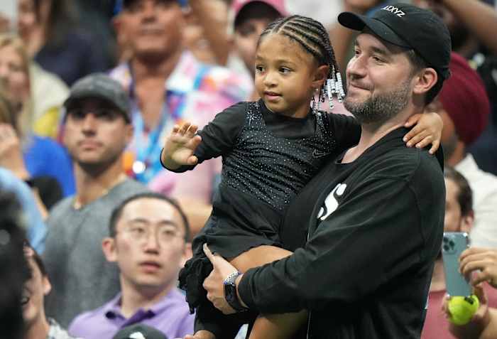 Alexis Ohanian and Alexis Olympia Ohanian Jr. watch Serena Williams during the first round of the 2022 U.S. Open